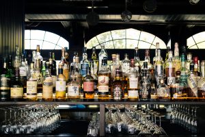 Back bar in a pub with a large collection of rare whisky bottles