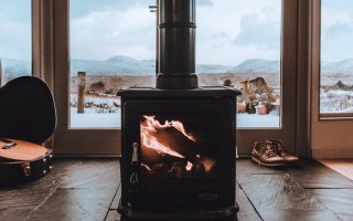 Sleek, modern stove in Glasgow home looking out to a seaside view